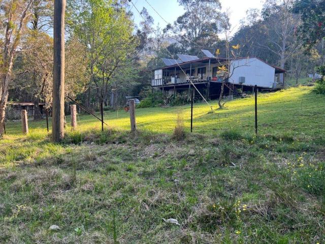 49.5 hectares, springwater,power, house and water tanks