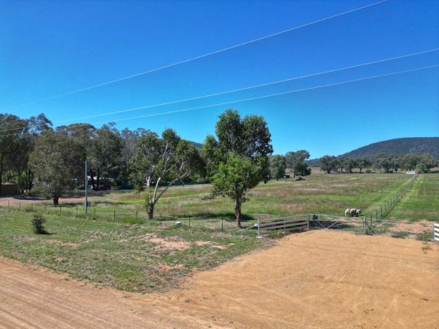 4 Acre Level Building block on outskirts of Village