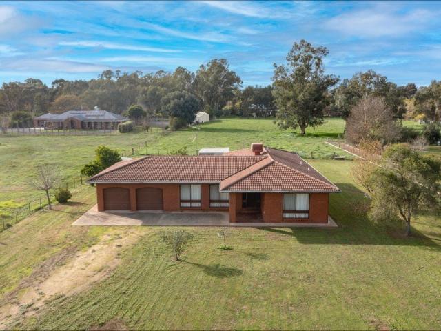 4 BEDROOM BRICK HOME ON 6.3 ACRES IN TOWN