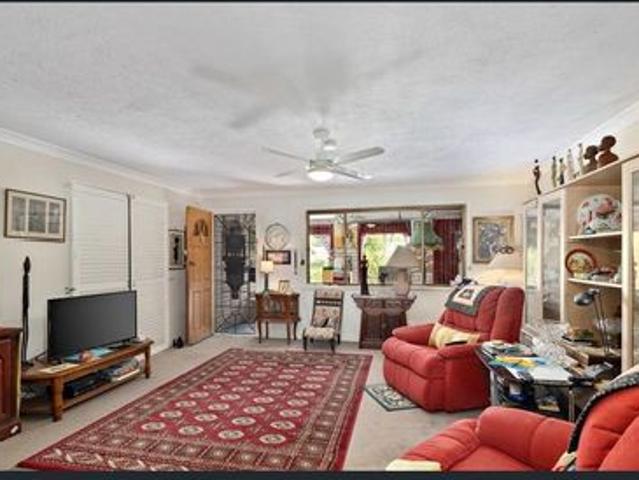 4 bedroom house with a large enclosed yard opposite park and school