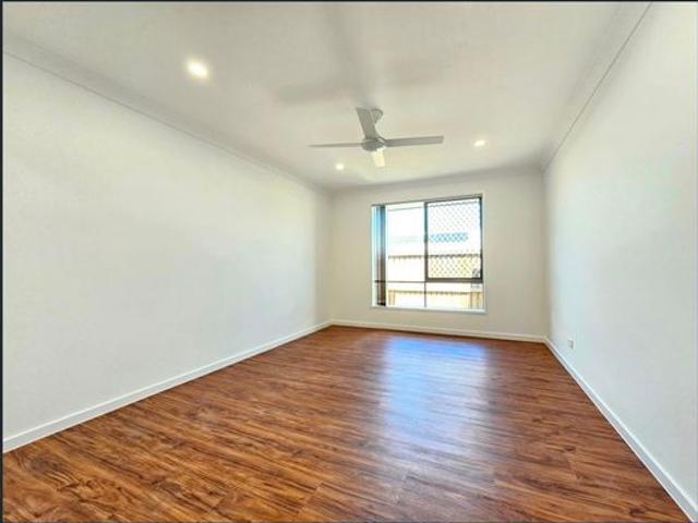 4 BEDROOMS WITH TWO LIVING AREAS. SECURITY SCREENS ON THE WINDOWS. AIR CON IN THE MASTER. TILES AND HYBRID FLOORING THROUGHOUT