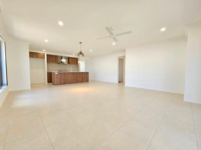 4 BEDROOMS WITH TWO LIVING AREAS. SECURITY SCREENS ON THE WINDOWS. AIR CON IN THE MASTER. TILES AND HYBRID FLOORING THROUGHOUT
