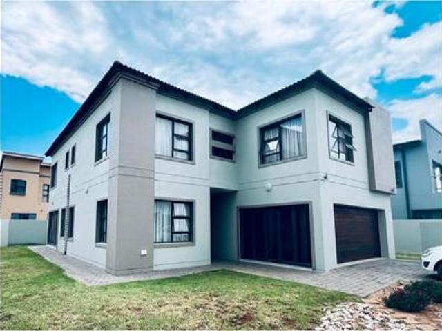 4 bedrooms 3 bathrooms 2 garages loc.