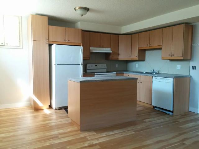 4Plex lower unit. 2 bedrooms with private in suite laundry