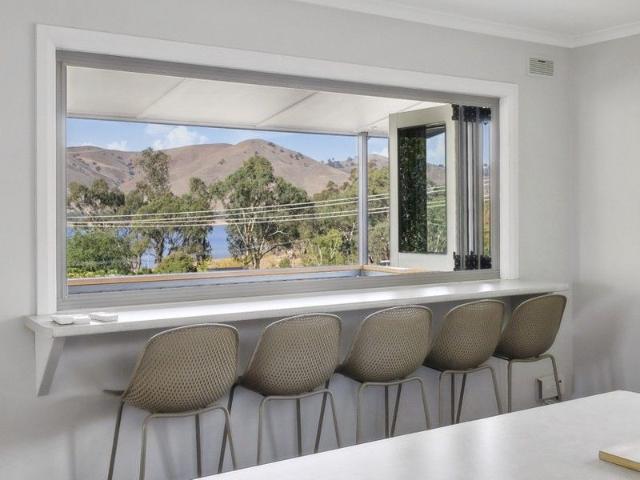 5 bedrooms plus a big boat shed, lined studio and lake views!