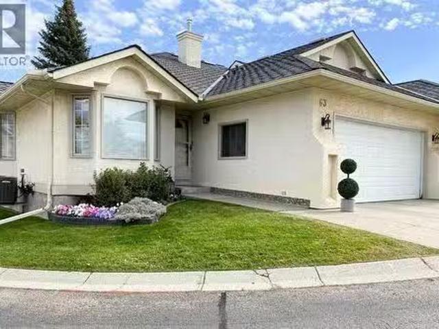 63 Edgepark Villas Nw, Calgary, AB, T3A 3S2 duplex for sale.