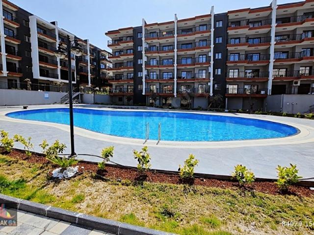 61'den Yetkili Kuşadası Ege Mahallesinde Satılık 2+1 Daire
