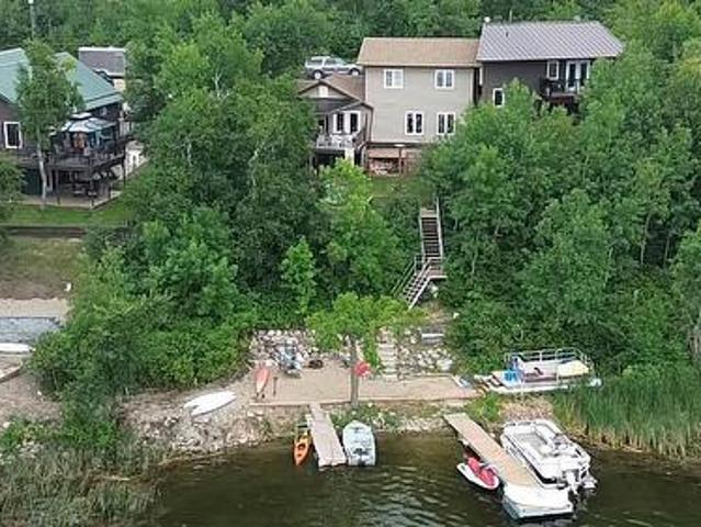 1058 Harry Passmore Road, Lake Metigoshe, MB, R0M 0M0 Luxury House for sale | Listing ID 202605 | Royal LePage Carriage Trade Luxury Properties