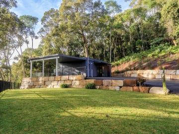 10 Acres of Rainforest Paradise with Permanent Spring Water & New Home