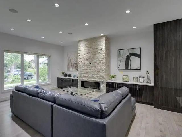 11045 85Ave! Beautiful custom built 2.5 storey home — 4 Bedrooms+ Den House