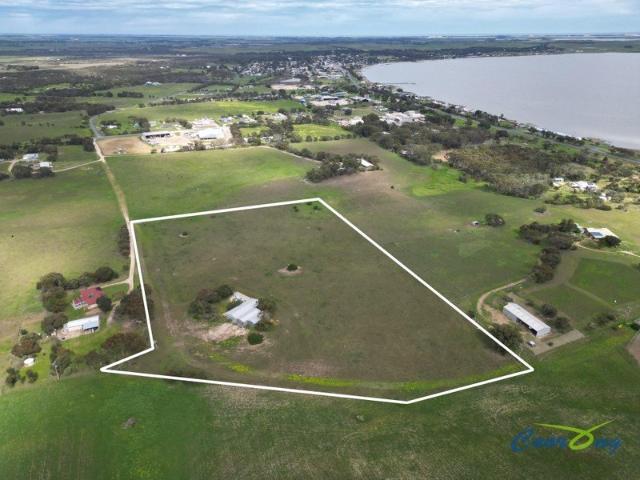 11.87 acres of lifestyle freedom with extensive shedding