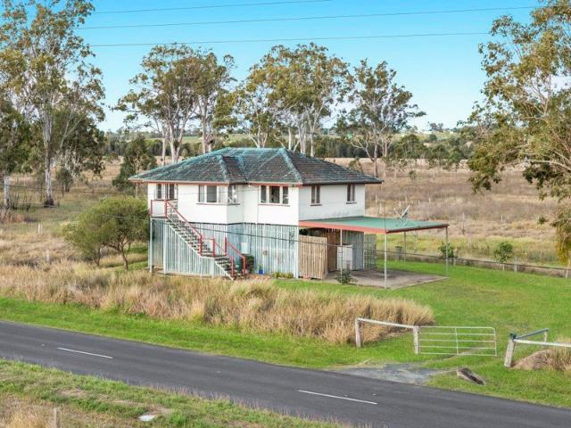 12.85 Acres with Creek Boundary, Paddocks and a Charming Family Home