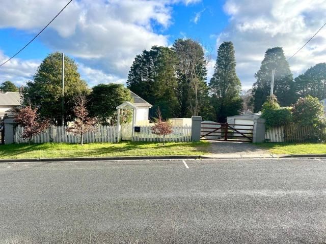 1346m block, walk to town in one of Old Bowral's best streets