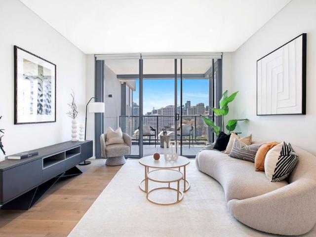 $1700 per week, including partial furniture Light Filled Corner Apartment with Darling Harbour Outlook