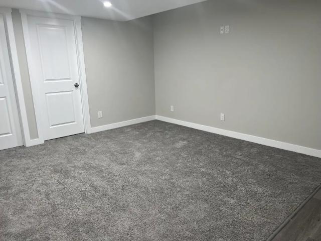 1 Bed + Den Basement with Side Entrance