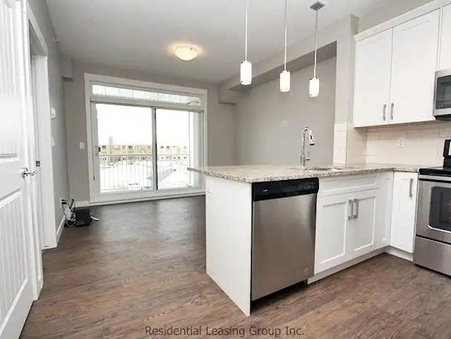 1 Bed + Flex Space in Auburn Bay | Heat & Water Included RP351 — 1 Bedroom+ Den Condo Unit