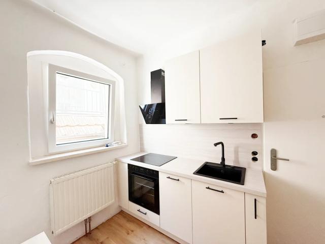 1 Zimmer Wohnung mit neuer Küche Mitten im Zentrum!