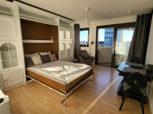 1 Zimmer Apartment mit Traumblick über München + Pool / Sauna und Tiefgaragenstellplatz