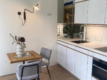 1 Zimmer Neubau in Innsbruck mit Balkon und Einbauküche