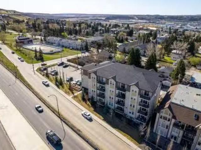 213 Mountain Street, Cochrane, AB, T4C 1C9 commercial for sa.