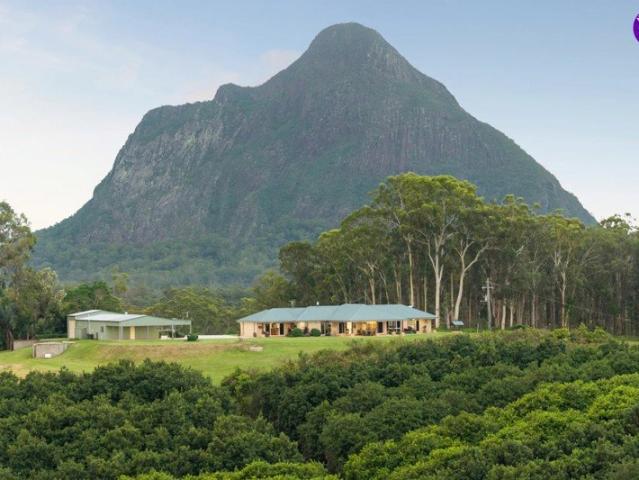 25 ACRES. TWO HOMES. MACADAMIA ORCHARD. ICONIC MOUNTAIN VIEWS