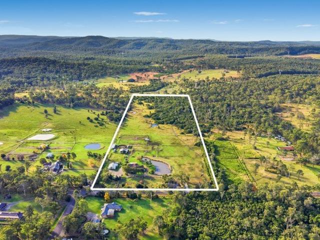 26 acres | dual occupancy | $111,800pa income | equestrian facilities