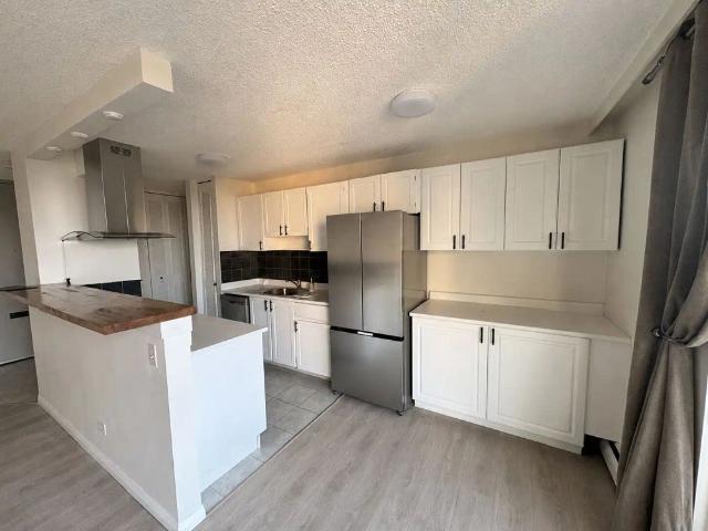2 Bed / 2 Bath Condo – River View + Utilities & Underground Parking Included — 2 Bedrooms Condo Unit