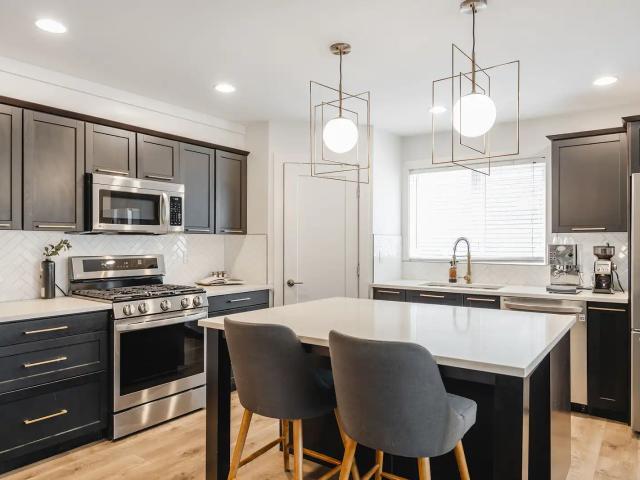 2 Bed, 2 Bath Fourplex in Killarney — 3 Storey with Loft, Gas Fireplace & A/C