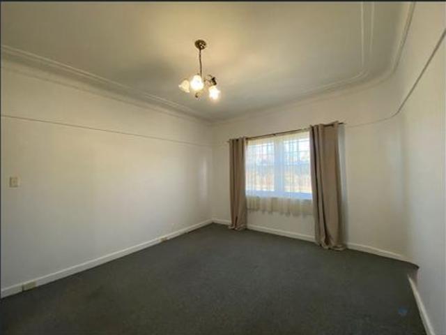 2 Bedroom Home with Sunroom and Double Car Garage!