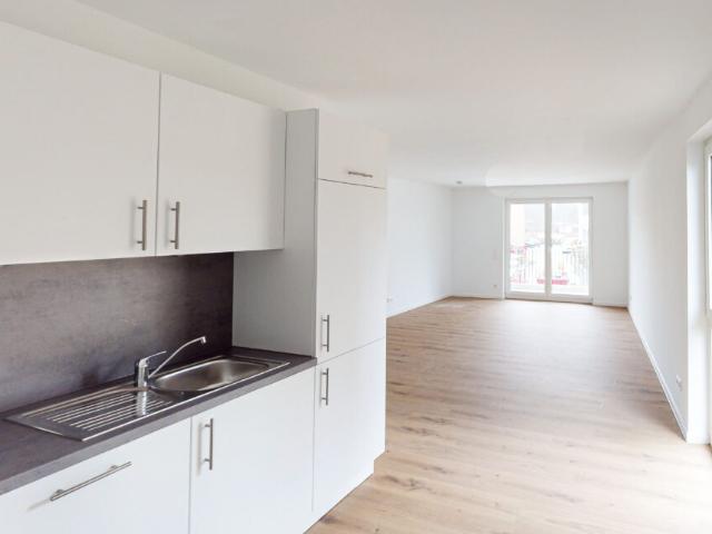2 Zimmer Neubauwohnung mit besonderem Schnitt! EBK und Balkon/Terrasse inklusive
