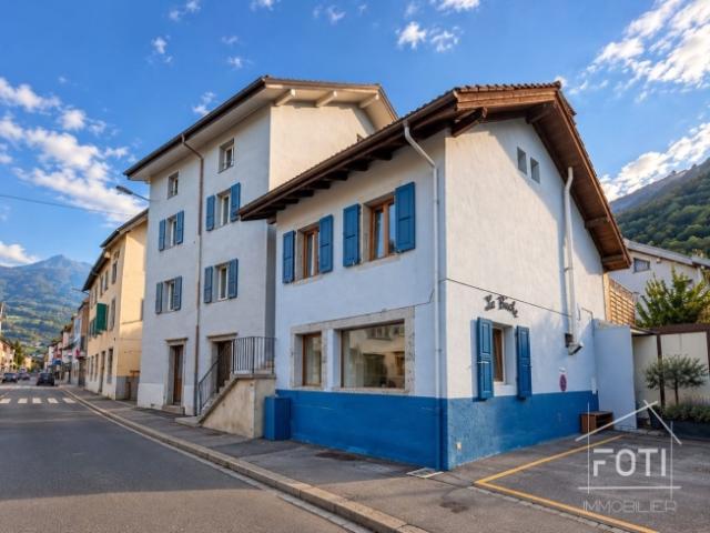 2,5 Zimmer Doppelhaus zum Verkauf in Collombey Muraz – vermietet mit einer Bruttorendite von 4,96 %