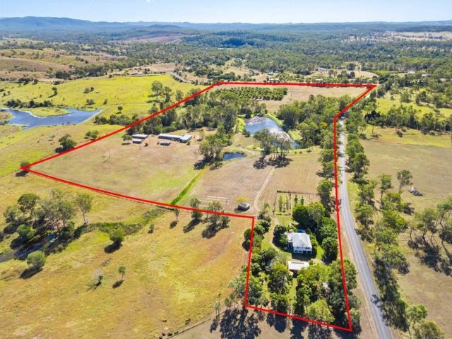 33 Acres of Lifestyle & Agricultural Opportunity Renovated Queenslander, Mango Orchard & Extensive Farm Infrastructure