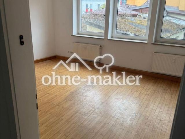 3 Zimmer Hochparterre Wohnung mit Einbauküche, Gemeinschaftsgarten und PKW Stellplatz