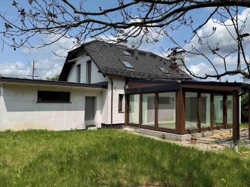 Nowoczesny dom z ogrodem zimowym i garażem 2 stanowiskowym