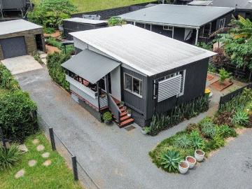 Tastefully Finished Island Retreat Elevated, Near New & Move In Ready! Veggie gardens fully established