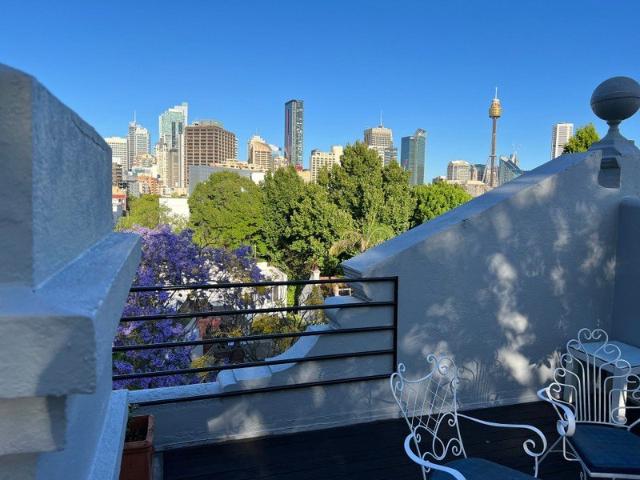 Terrace with rooftop garden overlooking city