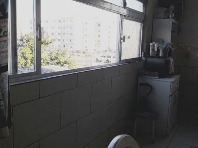 Terreno com 2 casas de Alvenaria