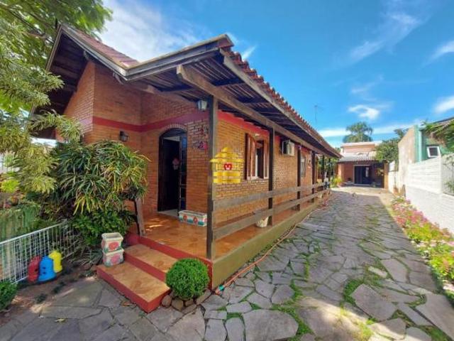 Terreno com 2 casas de alvenaria Bairro Scharlau