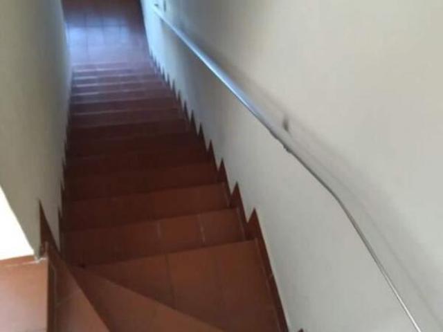 Terreno com 3 casas. Ótimo para renda!