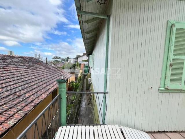 TERRENO COM CASA MISTA
