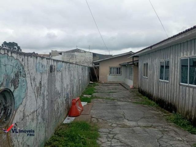 Terreno com casa á venda no bairro Pinheirinho em Curitiba PR