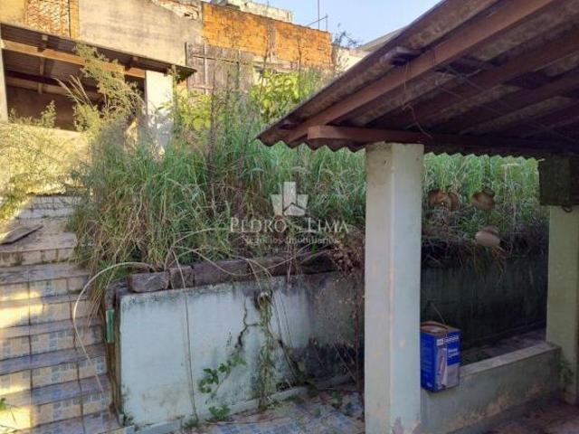 Terreno com casa antiga
