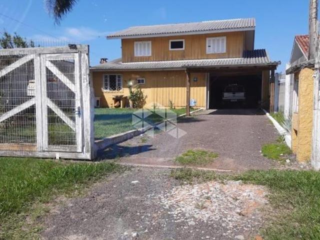 Terreno com casa de madeira, 2 dormitórios, bairro Santa Luzia, Capão da Canoa