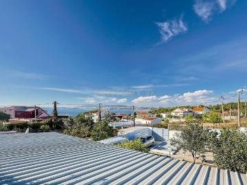 Terreno com Casa de Madeira e Vista Panorâmica em Quinta da Raposeira, Caparica