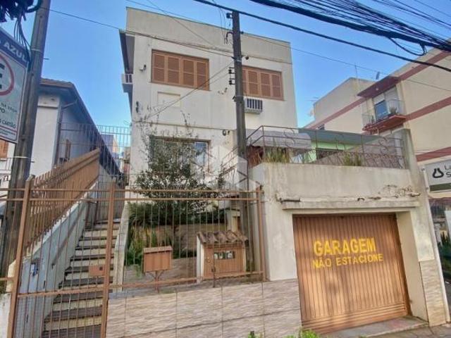 Terreno com casa e 02 apartamentos a venda no bairro Centro