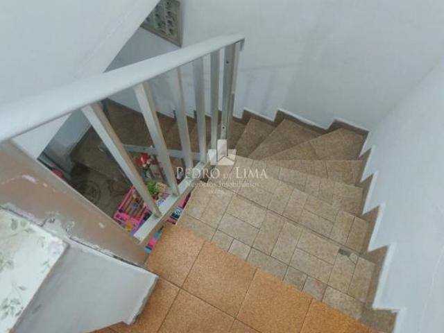 Terreno com casas e salão comercial na Penha