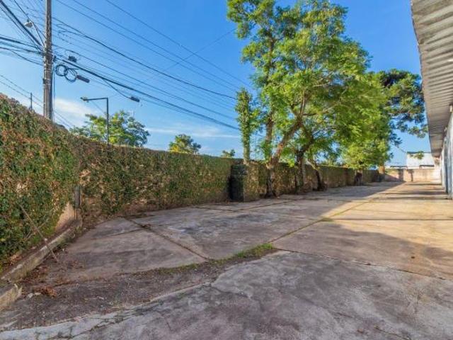 TERRENO COMERCIAL NA FRENTE DA LINHA VERDE COM BARRACÃO EM CIMA