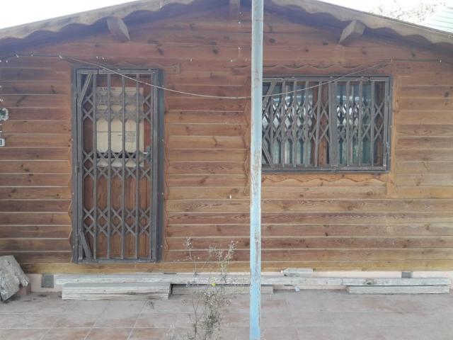 TERRENO CON CASA DE MADERA EN EL ESPARRAGAL DETRÁS DE CANTALARES