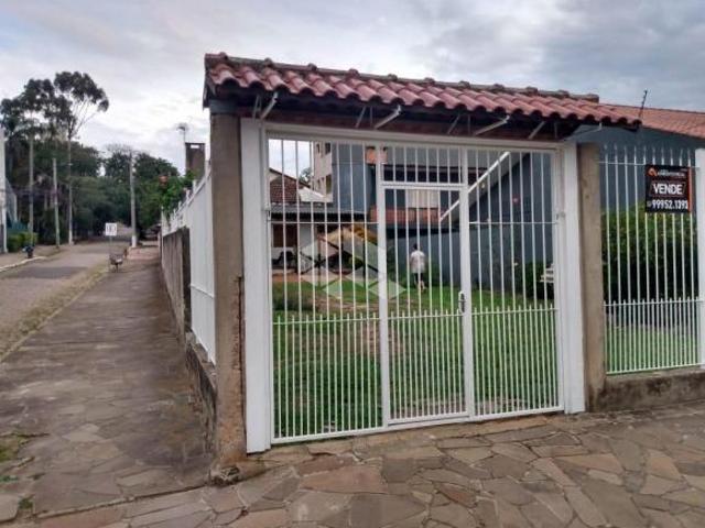 Terreno de esquina com casa no bairro Vila Ipiranga