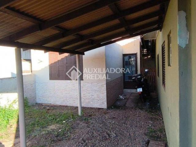 Terreno de esquina com 3 casas em canoas
